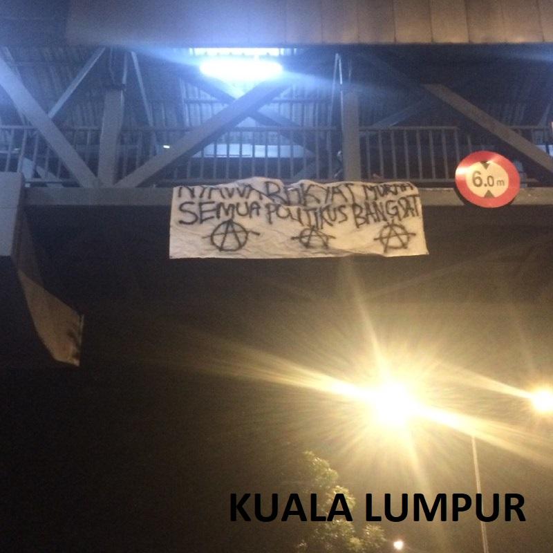 m-c-malaysian-comrades-banner-drop-action-by-malay-6.jpg